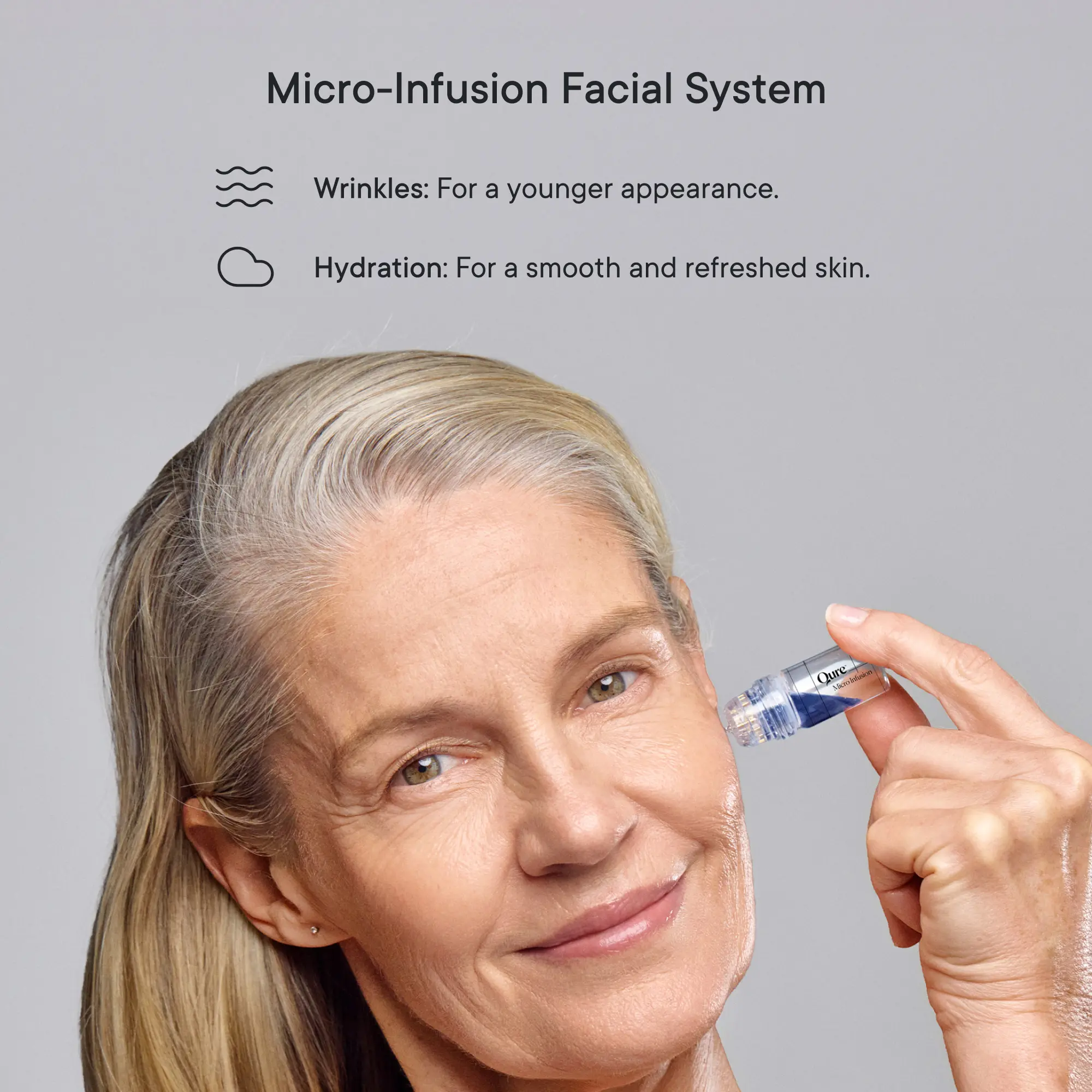 Woman over 60 using the Qure Micro-Infusion Facial System